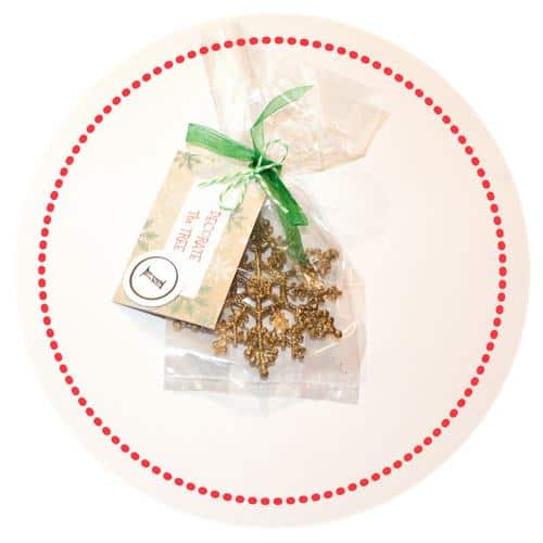 gold snowflake ornament in clear bag with gift card 1 attached