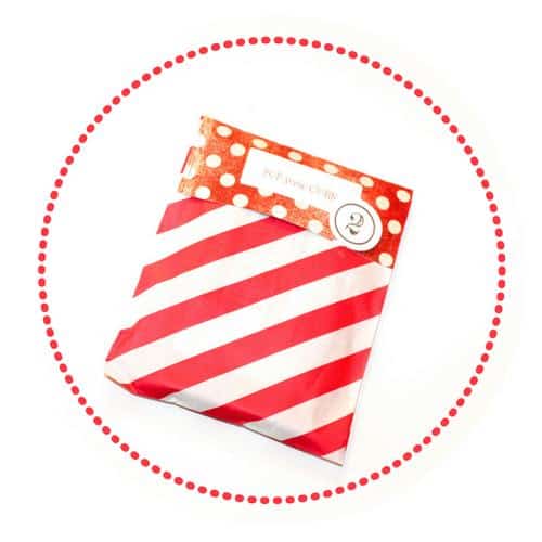 2. POP some Corn gift card with popcorn wrapped in white and red