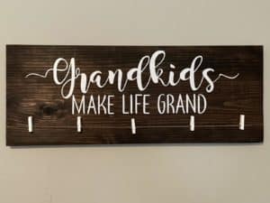 Wooden sign "Grandkids make life grand"
